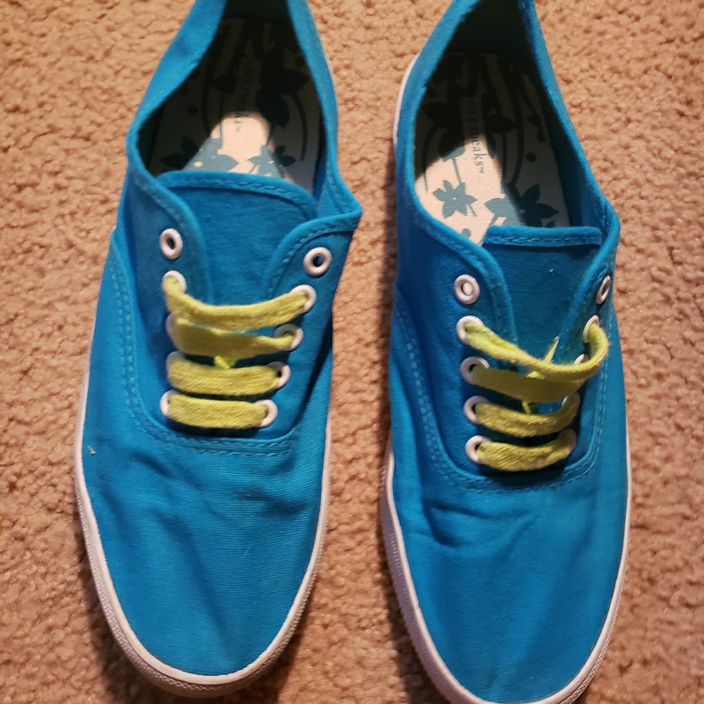 Blue canvas shoes with green laces
